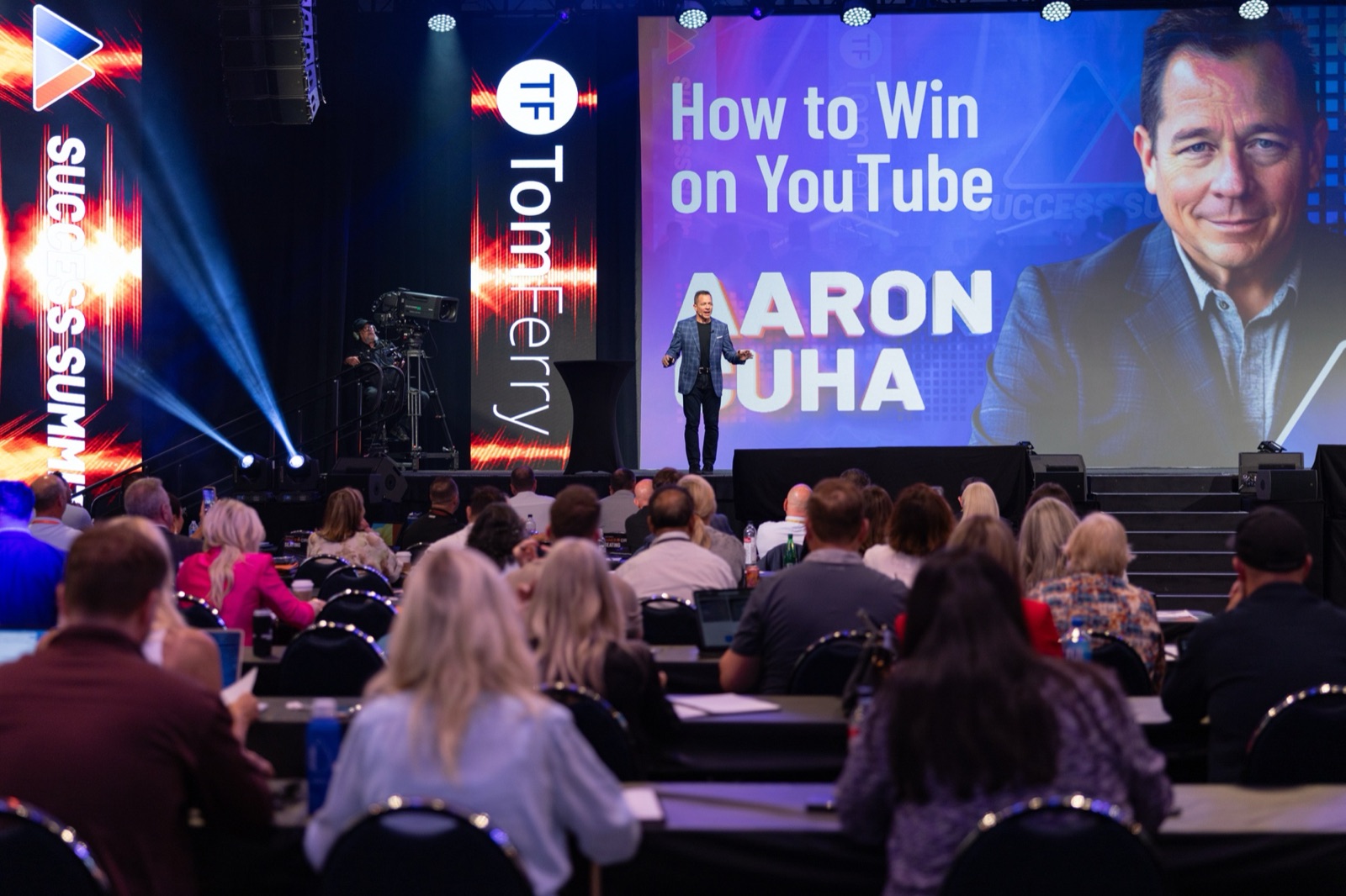 A packed room of agents at Tom Ferry Success Summit during Aaron's How to Win on YouTube session